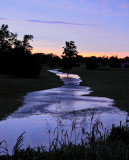 Mayo creek is swollen out of its banks after several days of heavy rain in Central Ky 