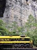 The 1069 looks small against the towering cliffs at Natural Tunnel