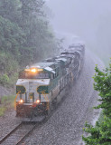 Strong wind and and heavy rain fill the valley at Parkers Lake as Southern 8099 rolls through the cut