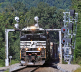A Southbound manifest passes Two generations of signals and whistle post at Southfork