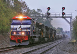 NS 6920, the Honoring our Veterans unit leads train 376 North under the signals at Blanchet KY in heavy rain