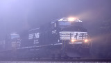 A Southbound grain train appears out of the fog after crossing the Cumberland River at Burnside
