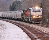 A Southbound grain train rolls across the soon to be double tracked construction area near CP Grove
