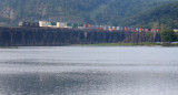 After an intense summer storm, fog is starting to form on the river as a Westbound crosses the bridge 