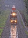 The Sound of a Trio of EMDs in #8 is all but drowned out by the rain as 223 climbs up Kings Mountain 