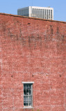 The SOB (State Office Building) looms over an old warehouse in Frankfort 