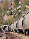 Southbound grain and GRS model SC searchlight signals on the banks of the Emory River 
