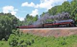 N&W 611 pulls her first public trip in 21 years as she crosses a fill just North of Gretna, NC on the old SOUTHERN mainline. 