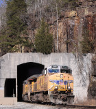 NS 179 pops out of the South end of Tunnel 24 at Nemo with a pair of crusty UP motors 