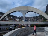 Favela at the backgound; this monument is similar to Carnival main place (Sambódromo) one. 