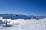 Upper chairlift with a view of the Walliser Alpen