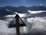 Clouds, cross and peaks