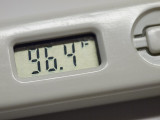 Number 96.4 on a digital thermometer
