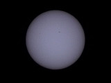 Mercury (the very small dot) in Transit across the sun (using a professional solar filter) is left of the larger central sunspot
