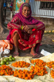 Selling garlands at the foot of the stupa