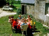 Hospitable French students lunching at their rented farmhouse in Brittany
