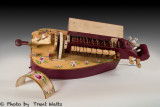 The Rose a Modern Hurdy Gurdy with covers removed and opened to see inner workings.