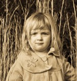 Girl in grass Sepia