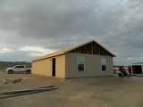 Roof and siding on, windows and one door set
