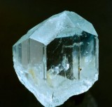 Topaz, Mount Gibson, Tablelands, Australia. Sharp pale blue transparent crystal, 2 x 2 cm.