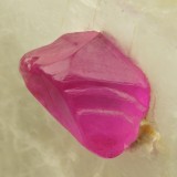 Ruby, transparent trigonal crystal in calcite. 7 mm crystal in 3 cm calcite matrix. Mogok, Burma.