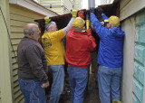 DISASSEMBLING AND CUTTING UP A RUSTED METAL STORAGE SHED IN THE ALLEY