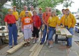 ANOTHER TEAM PHOTO  -  AS YOU CAN SEE FROM THE SIZE OF THE LUMBER PILE, WE HAVE ALMOST FINISHED THE DECK