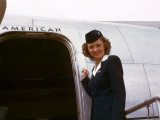 Stewardess,_circa_1949-50,_American_Overseas,_Flaghip_Denmark,_Boeing_377_Stratocruiser.jpg