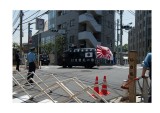 Having been prevented from getting to the Korean Embassy, Japanese Nationalists drive off