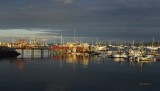 Rockland Maine  after a rain and clouds giving way to the setting sun .