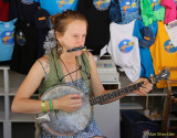 Volunteer Sasha playing from the Info Booth