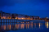 Houses on Betis street to Isabel bridge Seville with Chapel of the Virgin of Carmen at dawn at Alfonso XIII Canal