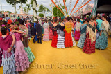 Young female students dressed in flamenco dresses at the April Fair in Seville