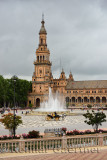 North tower and Vicente Traver fountain with horse and carriage at Plaza de Espana Seville