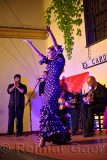 Female Flamenco tap dancer on stage at night in an outdoor courtyard in Cordoba Spain