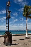 Searching for Reason sculpture with ladder on Malecon Puerto Vallarta Mexico