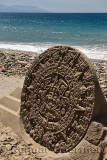Sand sculpture of an Aztec sun dial on the beach at Malecon Puerto Vallarta Mexico
