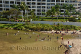 Local children and families playing in the Cuale river at Olas Altas Beach Puerto Vallarta