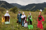 Kazakh family in traditional clothes after Tusau Kesu ceremony in field at Huns Village Kazakhstan