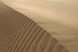 Abstract ripples at Singing Sand Dune peak Altyn Emel National Park Kazakhstan
