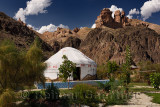 Yurt accommodation at Eco Park in Charyn Canyon National Park with red sandstone hoodoos Kazakhstan