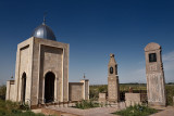 Marble mausoleum granite headstones at Roadside Muslim cemetery near Shelek Kazakhstan