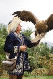 Trainer holding a White Tailed Eagle ready to fly at Sunkar Falcon Farm Almaty Kazakhstan