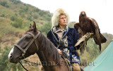 Bird trainer on horseback and Golden Eagle at Sunkar Raptor Center Almaty Kazakhstan