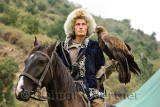 Bird trainer on horseback holding a Golden Eagle at Sunkar Raptor Center Almaty Kazakhstan