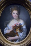 Jean-Baptiste Greuze - Jeune femme couronnant de fleurs un petit épagneul noir, dite Madame de Porcin, (1770) - 5109