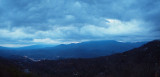 Panorama - Stormy vista at sunrise above the valley