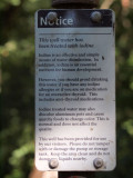 Sign on water pump on the trail
