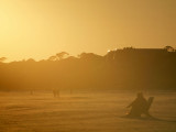 On the beach as the sun sets