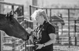 Kate Gomalek photographing at a rodeo (2013)